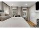 Comfortable bedroom features a king-sized bed and lots of natural light from the windows at 573 Amsterdam Ne Ave, Atlanta, GA 30306
