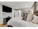 Spacious bedroom features a king bed, a fireplace, and lovely built-in storage at 573 Amsterdam Ne Ave, Atlanta, GA 30306