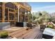 Expansive wooden deck with multi-tiered screened porch and outdoor seating, great for entertaining at 573 Amsterdam Ne Ave, Atlanta, GA 30306