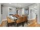 Dining room with modern glass table, comfortable chairs, and stylish decor, perfect for gatherings at 573 Amsterdam Ne Ave, Atlanta, GA 30306