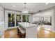 Kitchen island with seating adjacent to a screened porch and living room, perfect for entertaining at 573 Amsterdam Ne Ave, Atlanta, GA 30306