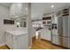 Well-lit kitchen with stainless steel appliances, and an open floor plan leading to living room at 573 Amsterdam Ne Ave, Atlanta, GA 30306