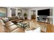 Comfortable living room with a leather sofa and hardwood floors at 573 Amsterdam Ne Ave, Atlanta, GA 30306