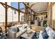 Relaxing sunroom with comfortable seating and a view of the backyard at 573 Amsterdam Ne Ave, Atlanta, GA 30306