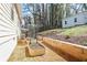 Well-maintained backyard showcasing garden beds, gravel, and lush greenery near the house at 91 Griggs Sw St, Marietta, GA 30064