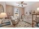 A delightful Bedroom with pink walls, a crib, rocking chair, and plenty of natural light at 91 Griggs Sw St, Marietta, GA 30064