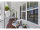 Charming front porch with seating, plants, and a porch swing, perfect for relaxing and enjoying the outdoors at 91 Griggs Sw St, Marietta, GA 30064