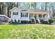 Charming single story home with inviting front porch, manicured lawn, and beautiful curb appeal at 91 Griggs Sw St, Marietta, GA 30064