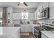 Modern kitchen with stainless steel appliances, granite countertops, and custom cabinets at 91 Griggs Sw St, Marietta, GA 30064