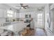 Well-appointed kitchen with an island, white cabinetry, and stainless steel appliances at 91 Griggs Sw St, Marietta, GA 30064