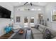 Modern living room with vaulted ceilings, a comfortable couch, with access to the outdoor patio at 91 Griggs Sw St, Marietta, GA 30064
