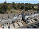 Expansive aerial shot features multi-story townhomes, tree-lined streets, and well-kept grounds at 2736 Bell Se Dr, Smyrna, GA 30080