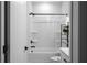 Bright bathroom featuring a white shower/tub combo with a curtain and black matte hardware and fixtures at 2736 Bell Se Dr, Smyrna, GA 30080