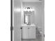 Bright bathroom features a sleek vanity with modern fixtures, plus a mirror and lighting at 2736 Bell Se Dr, Smyrna, GA 30080