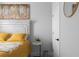 Bedroom with neutral walls, bright bedding, modern decor and a white door with a black handle at 2736 Bell Se Dr, Smyrna, GA 30080
