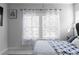 Cozy bedroom with soft lighting, sheer curtains, and comfortable bedding, perfect for relaxation at 2736 Bell Se Dr, Smyrna, GA 30080