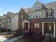 Charming townhome boasts a brick facade, complemented by gray siding and a neatly fenced front yard at 2736 Bell Se Dr, Smyrna, GA 30080