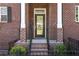 Brick front entrance featuring a black door, rail, and classic address numbers at 2736 Bell Se Dr, Smyrna, GA 30080