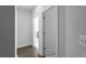 Bright hallway with gray walls, wood floors, and white doors leading to various rooms at 2736 Bell Se Dr, Smyrna, GA 30080