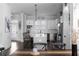 Bright kitchen featuring white cabinets, subway tile backsplash, stainless appliances, and island with seating at 2736 Bell Se Dr, Smyrna, GA 30080