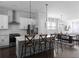 Modern kitchen featuring white cabinets, stainless steel appliances, and bar seating at the island at 2736 Bell Se Dr, Smyrna, GA 30080