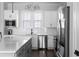 Stylish kitchen with stainless steel appliances, modern cabinets, sleek countertop, and subway tile backsplash at 2736 Bell Se Dr, Smyrna, GA 30080