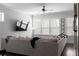 Comfortable living room with a large sectional sofa, plenty of natural light, and a ceiling fan at 2736 Bell Se Dr, Smyrna, GA 30080