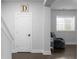 Inviting living room area with gray walls, dark wood floors, and comfortable armchair by bright window at 2736 Bell Se Dr, Smyrna, GA 30080