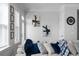 Modern living room with a large sectional sofa, window views, and stylish decor at 2736 Bell Se Dr, Smyrna, GA 30080