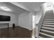Living room with hardwood floors, stairs, and ample space for seating and entertainment at 2736 Bell Se Dr, Smyrna, GA 30080
