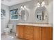 Bathroom with double sinks and bright natural lighting at 1135 Parkview Sw Way, Lilburn, GA 30047