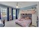 Charming bedroom with a bunk bed, ceiling fan, and natural light from the window at 1135 Parkview Sw Way, Lilburn, GA 30047