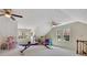 Expansive bonus room offering flexible space for recreation, featuring two ceiling fans and large windows at 1135 Parkview Sw Way, Lilburn, GA 30047
