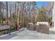 Outdoor deck with wicker seating and wooded view, perfect for relaxation and outdoor enjoyment at 1135 Parkview Sw Way, Lilburn, GA 30047