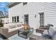 Inviting deck area featuring comfortable patio seating with wicker furniture, perfect for outdoor entertaining at 1135 Parkview Sw Way, Lilburn, GA 30047