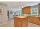 Classic kitchen featuring light wooden cabinets, stainless steel appliances, and a functional center island at 1135 Parkview Sw Way, Lilburn, GA 30047
