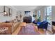 Comfortable living room with hardwood floors, area rug, and natural light at 1135 Parkview Sw Way, Lilburn, GA 30047