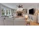 Spacious living room with hardwood floors, fireplace, and built-in shelving at 1135 Parkview Sw Way, Lilburn, GA 30047