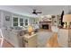 Well-lit living room with hardwood floors, fireplace, and built-in shelving at 1135 Parkview Sw Way, Lilburn, GA 30047