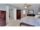 Bright, airy primary bedroom with ensuite bathroom and ample storage space, and ceiling fan at 1135 Parkview Sw Way, Lilburn, GA 30047