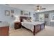 Main bedroom with bright natural lighting, ceiling fan and elegant furniture at 1135 Parkview Sw Way, Lilburn, GA 30047