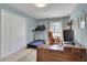 Home office featuring a wooden desk, a treadmill and bright natural lighting at 1135 Parkview Sw Way, Lilburn, GA 30047