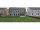 View of the backyard, showcasing a new home construction and green grass at 3718 Southfield Ct, Loganville, GA 30052