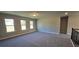 Upstairs bonus room filled with natural light and ample space for recreational activities at 3718 Southfield Ct, Loganville, GA 30052