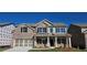 Beautiful brick two-story home with a covered front porch and two-car garage, perfect for Gathering living at 3718 Southfield Ct, Loganville, GA 30052