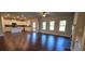 Spacious living room featuring hardwood floors, white trim, and an open concept design with plenty of natural light at 3718 Southfield Ct, Loganville, GA 30052
