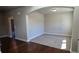 Cozy sitting room with plush carpet, neutral walls, and an archway entrance, offering a comfortable retreat at 3718 Southfield Ct, Loganville, GA 30052