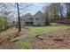 Backyard view of the home with a patio and deck, perfect for outdoor entertaining at 525 Hilliard Ct, Suwanee, GA 30024