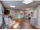 Basement craft room featuring wood floors, open shelving and storage, and crafting tables at 525 Hilliard Ct, Suwanee, GA 30024