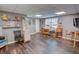 Spacious finished basement with ample lighting, wood floors, and a sewing station with cabinets and shelving at 525 Hilliard Ct, Suwanee, GA 30024